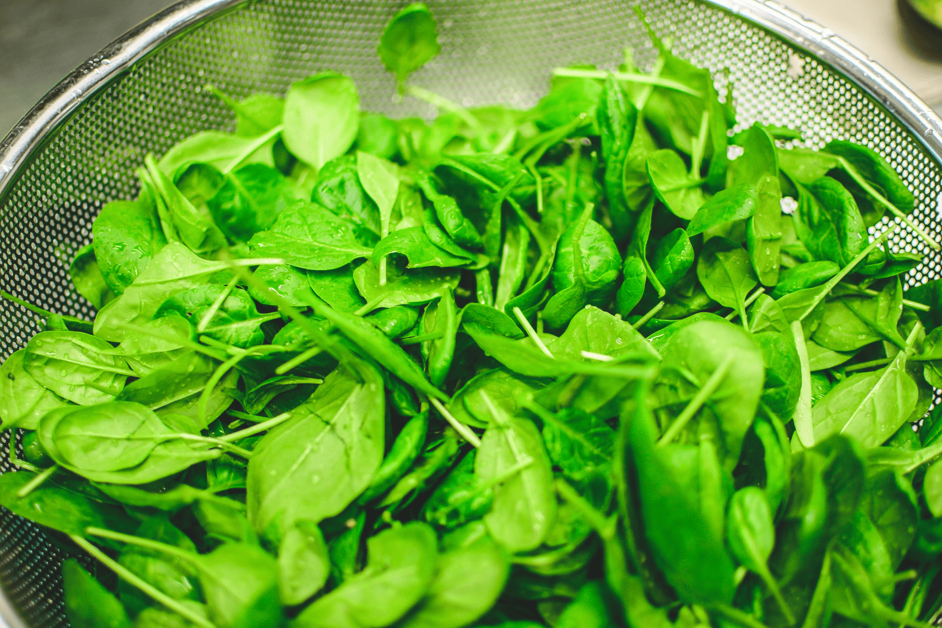 A fresh bunch of leafy green spinach and kale.