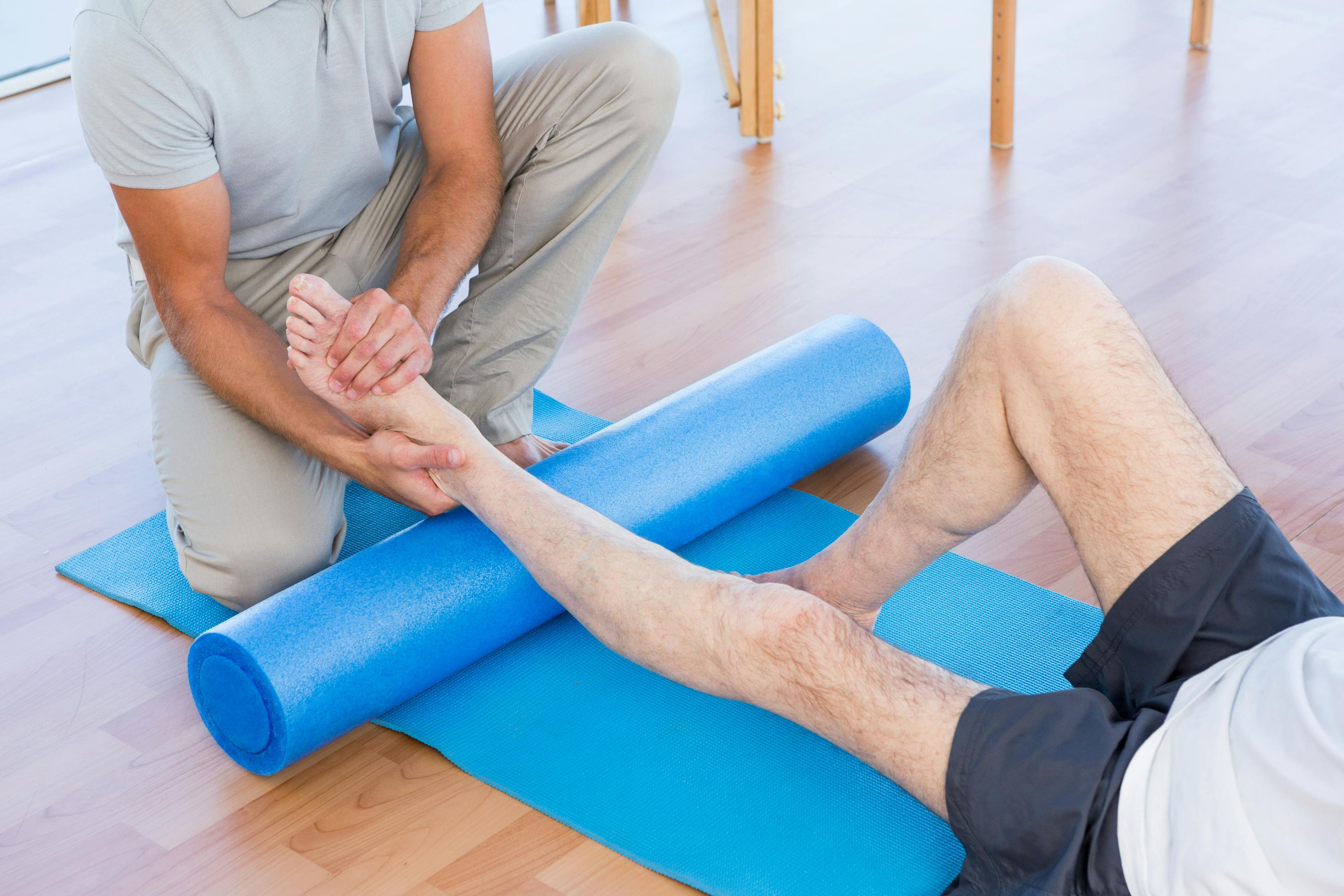A demonstration of ankle circles and flexing movements to improve joint mobility.