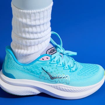 A collection of different brands and styles of women's walking shoes grouped together.