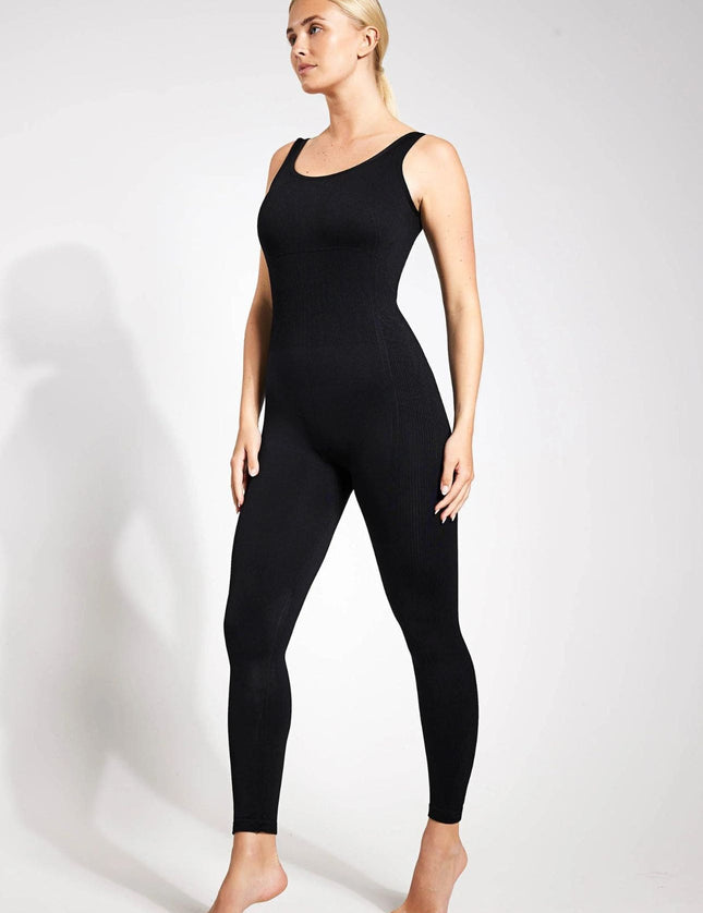 Close-up of a black seamless workout unitard showing the compressive fabric texture.