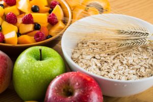 A variety of high-fiber whole foods including beans, grains, and legumes.
