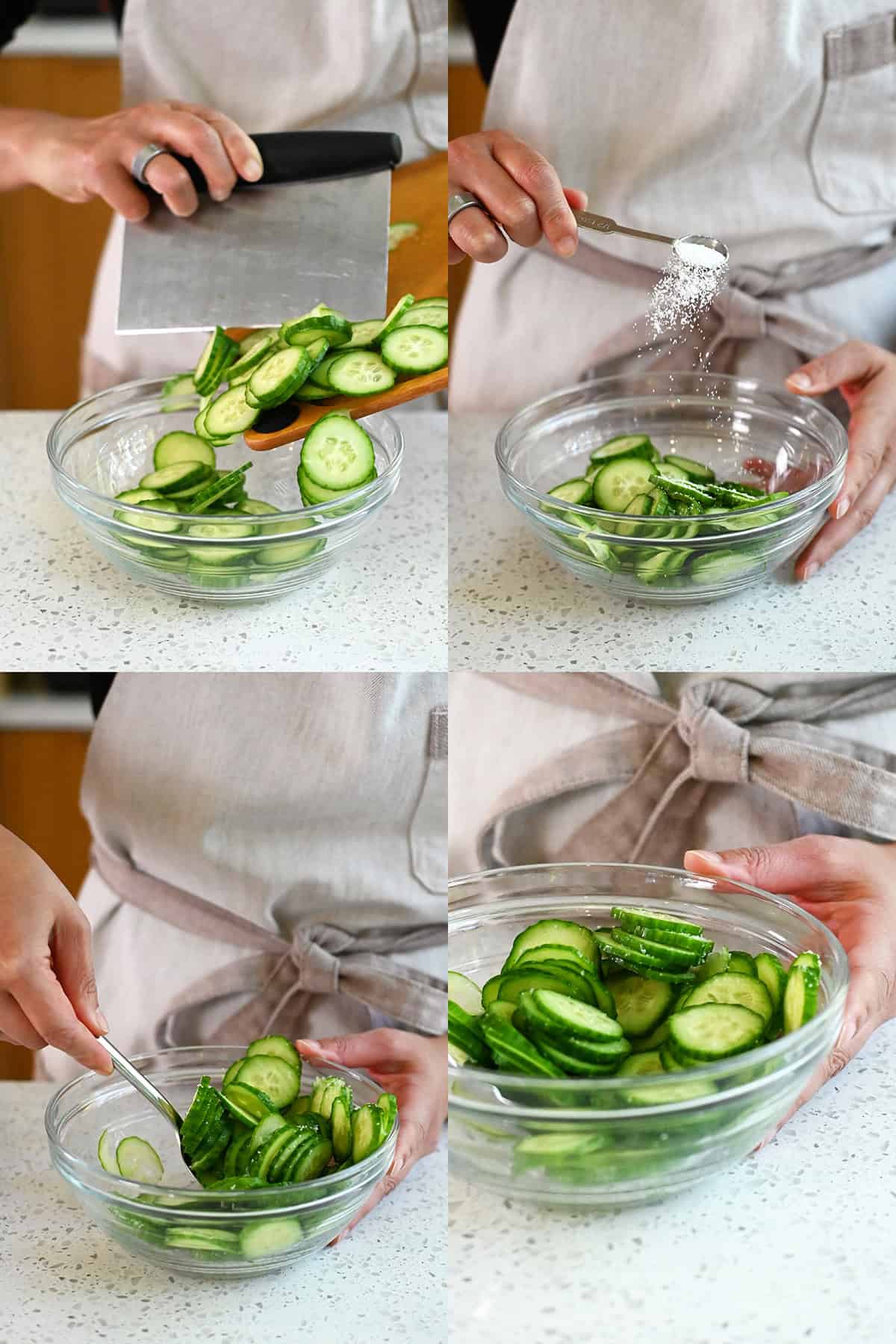 Thinly sliced Persian cucumbers being tossed with salt in a bowl.
