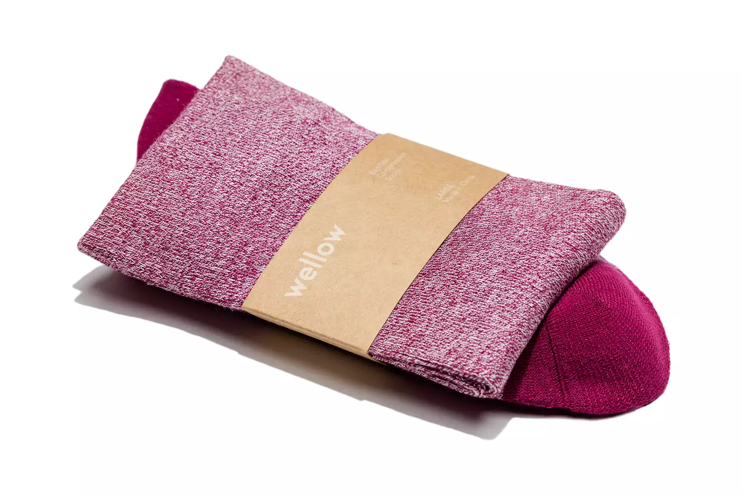 A pair of Wellow brand maroon compression socks with a minimalist cardboard band.