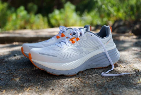 Product shot of the Saucony Hurricane 24 running shoe designed for stability and foot pain relief.