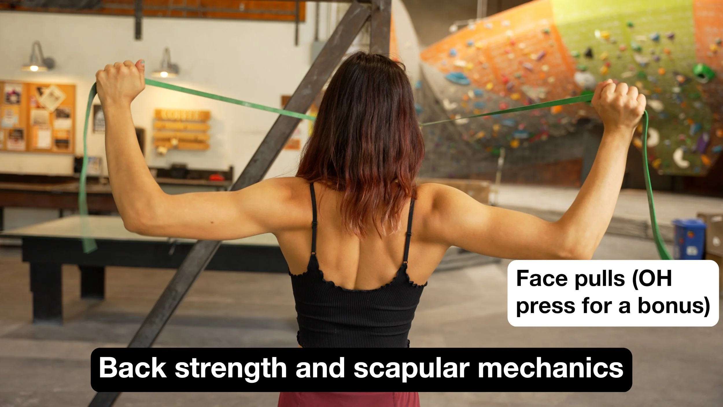 A man using a resistance band to perform face pulls for shoulder health and scapular stability.