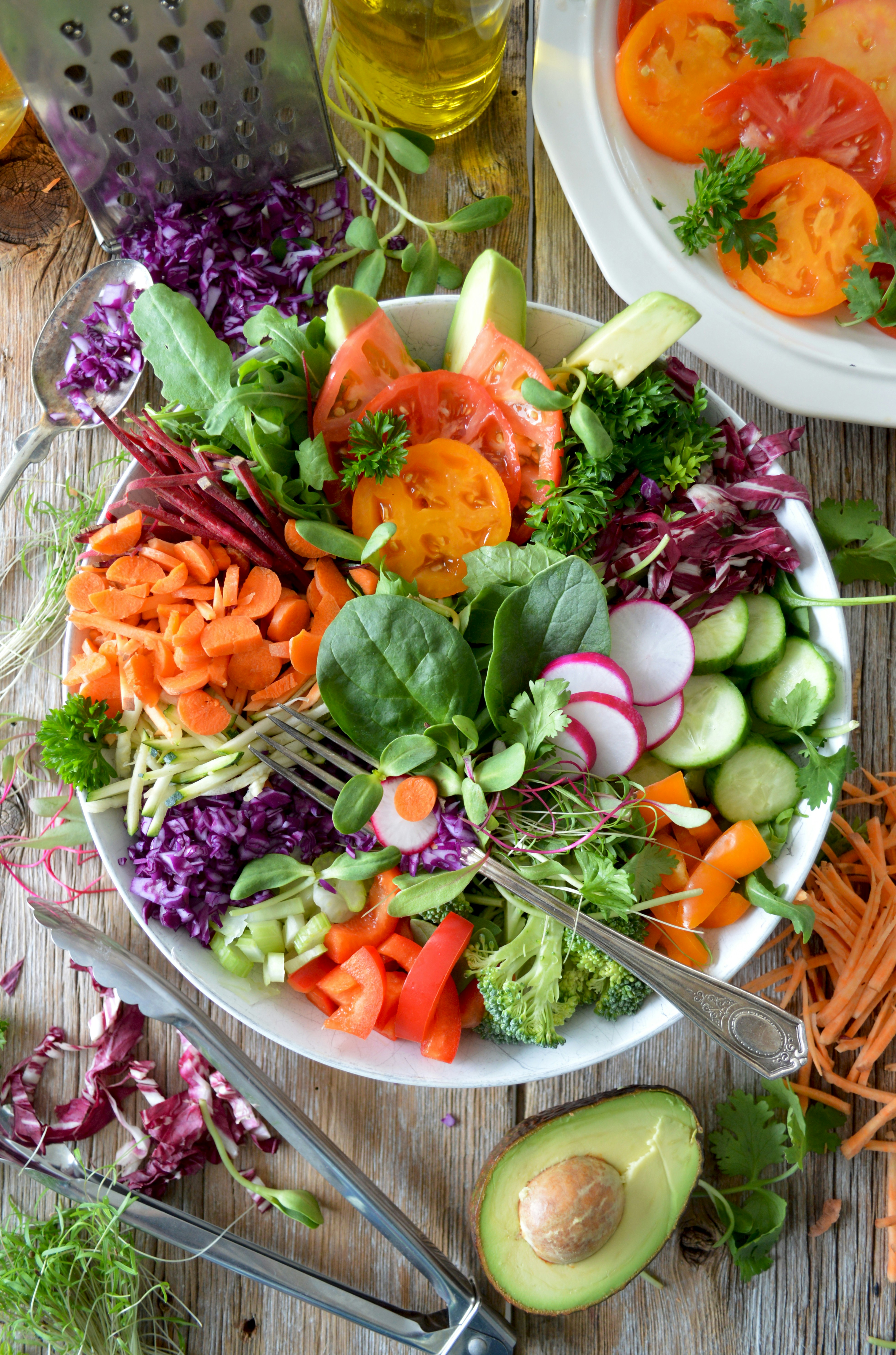 A healthy grain bowl featuring quinoa, roasted vegetables, and leafy greens.