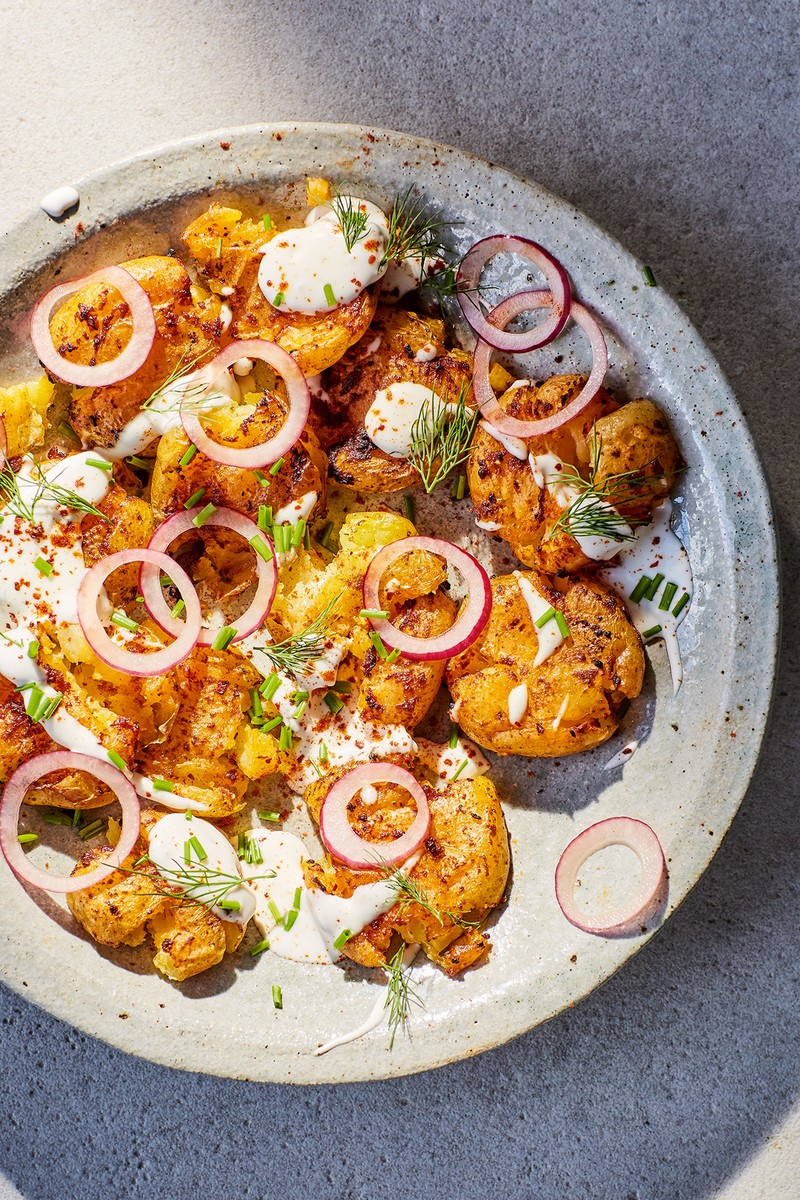 Crispy smashed potatoes served with a side of creamy lemon mayo dipping sauce.
