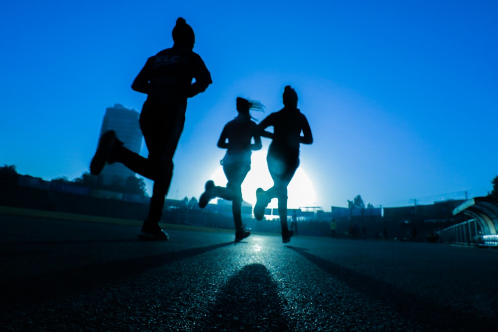A close-up of a runner's wrist checking a fitness tracker watch during a workout.
