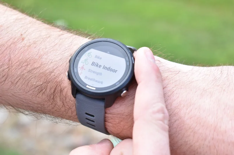 Side profile of the Garmin Forerunner 245 on a runner's wrist during an active run.