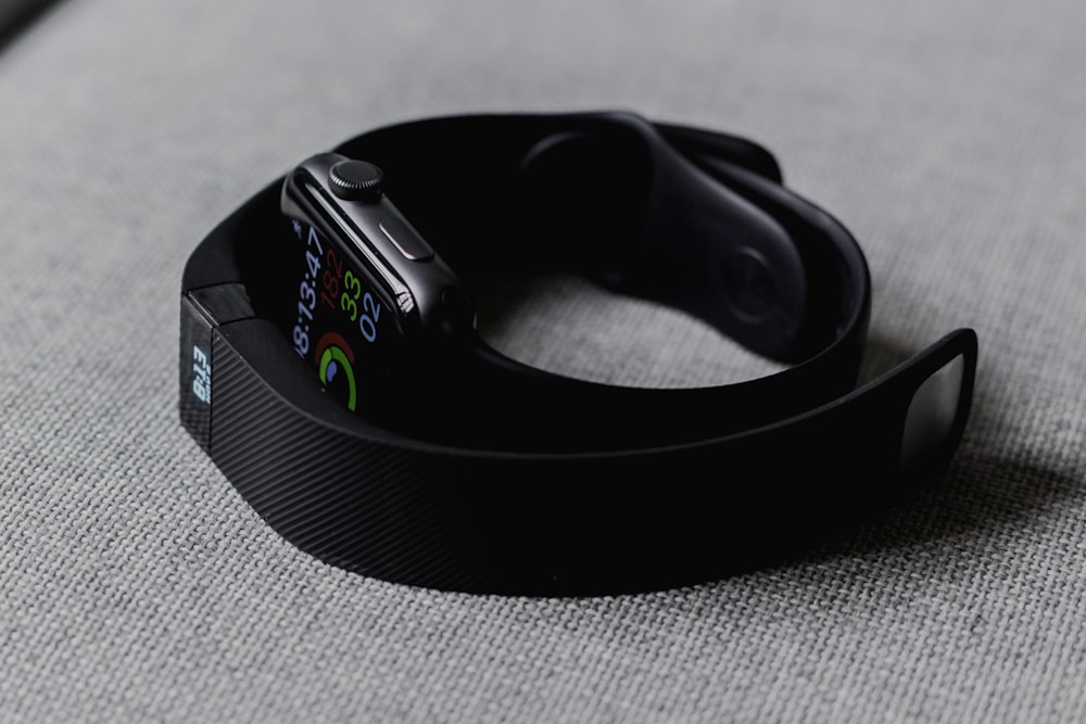 Close-up of a smartwatch displaying fitness metrics and heart rate during a workout.