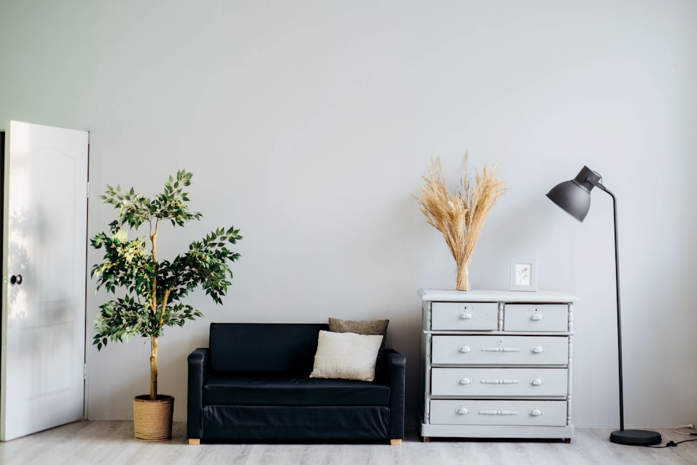 A modern, minimalist bedroom featuring effective blackout window treatments.