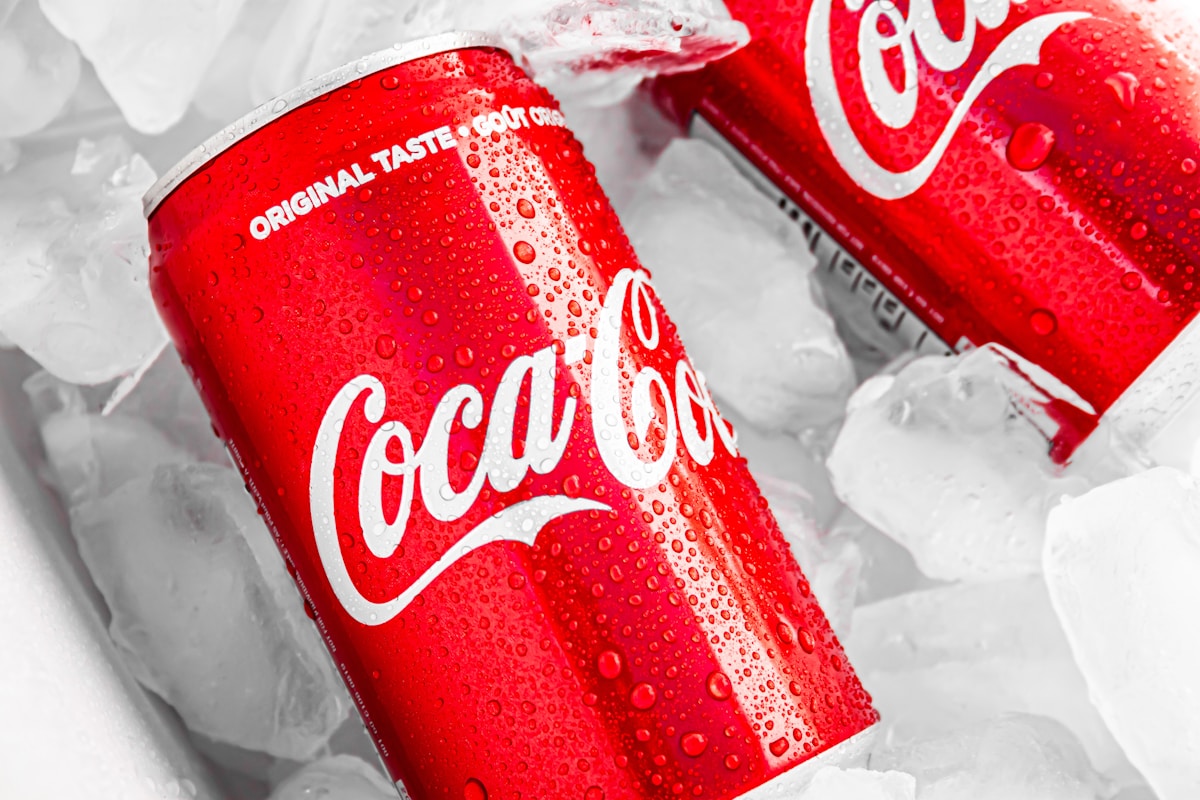 A collection of various sodas and sugar-sweetened soft drinks.