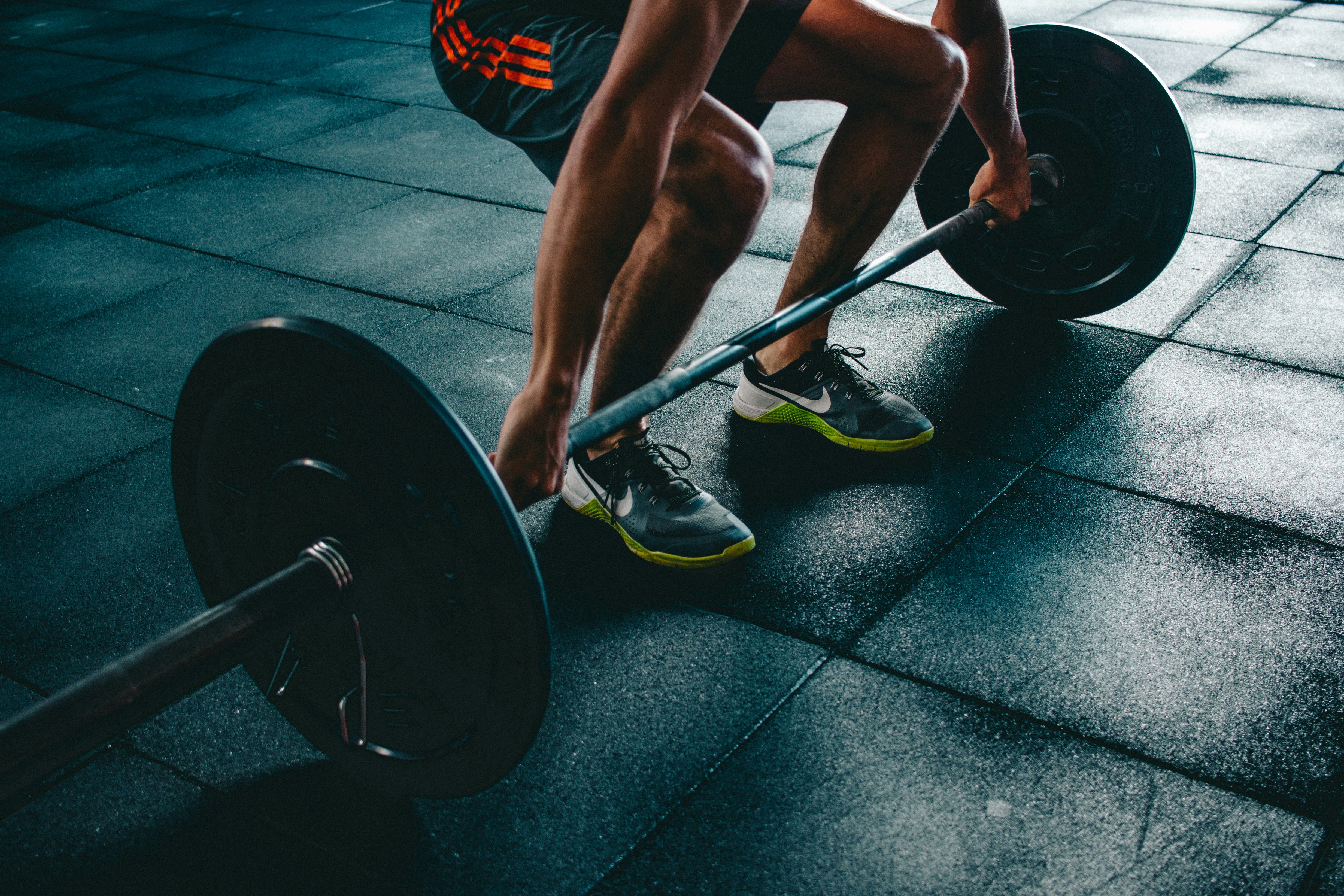 A person lifting light dumbbells for resistance training.