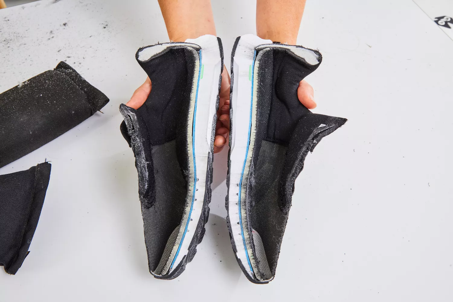 A cross-section of a running shoe cut in half to reveal the internal foam layers and structural components.