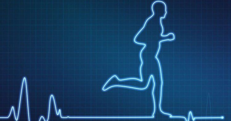 A person checking their pulse while walking to measure exercise intensity.