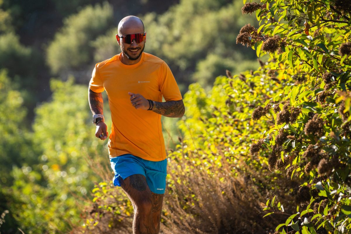 A runner wearing the Montane Dart Nano T-Shirt on a dry, singletrack trail.