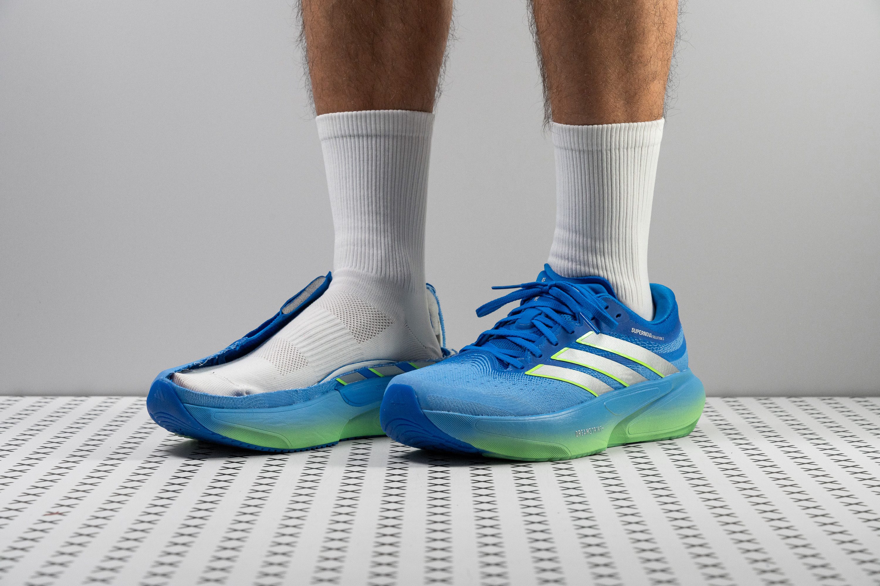 The Adidas Supernova Solution 3 running shoe shown from a side profile.