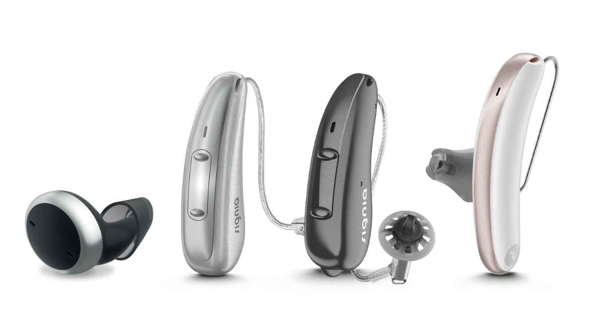 A lineup of various Signia AX hearing aid models in different colors and sizes.
