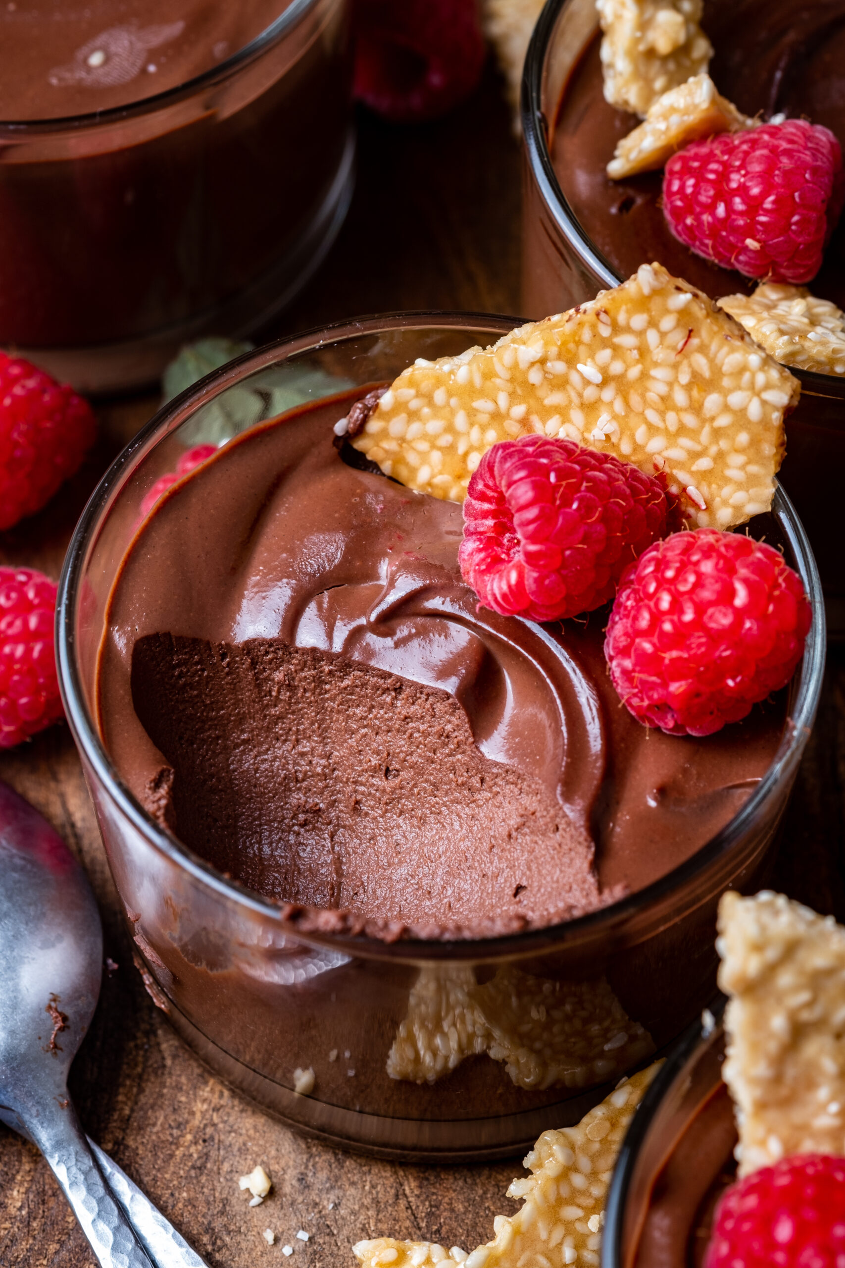 A beautifully plated portion of vegan chocolate tahini mousse with a crisp garnish.