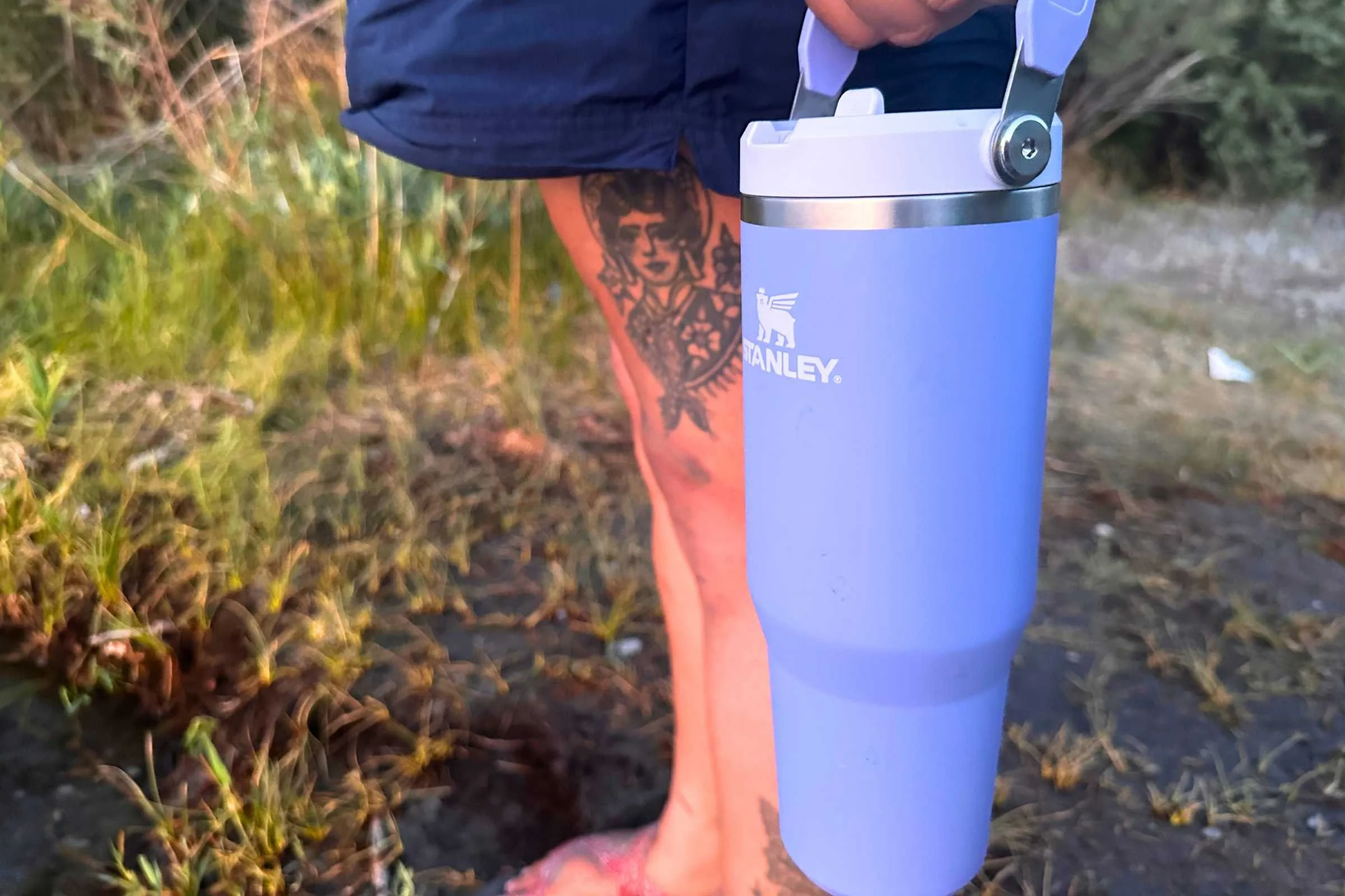 Detailed close-up of the integrated carry handle on a Stanley IceFlow tumbler.