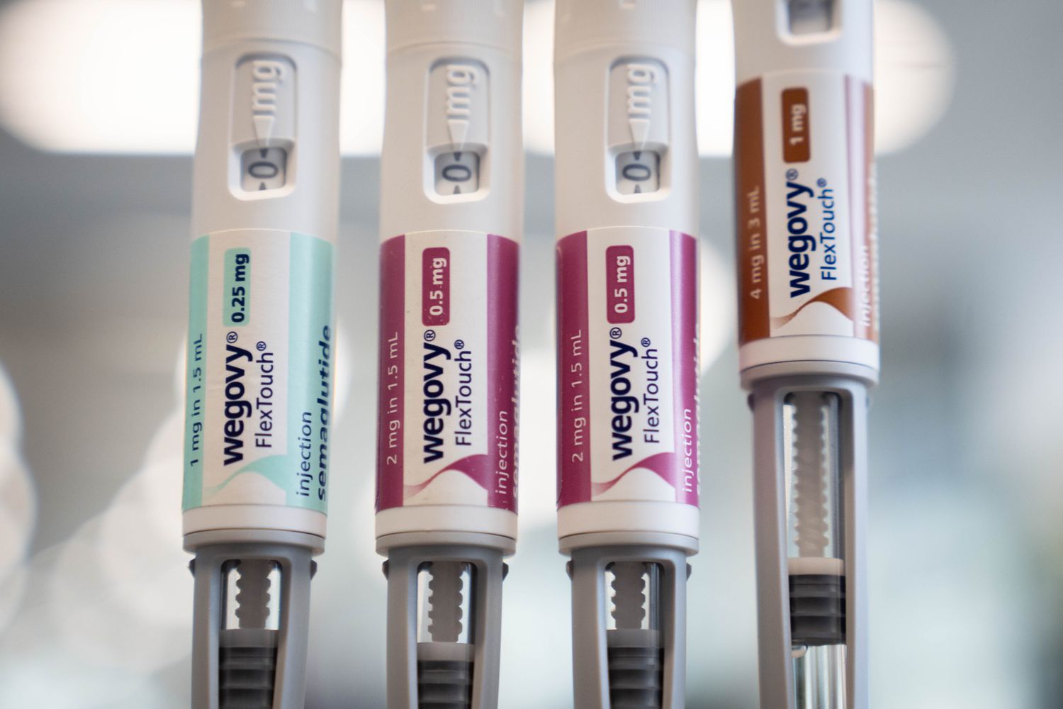 A collection of injectable medication pens in various dosages used for diabetes and weight management.