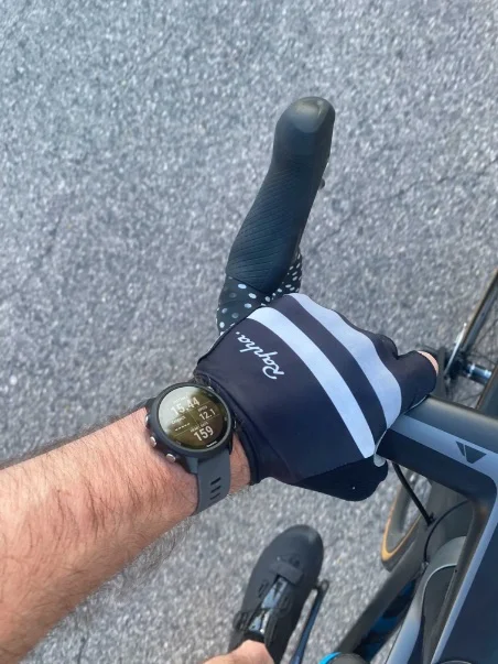 Close-up view of the Garmin Forerunner 245 circular watch face showing a running activity screen.