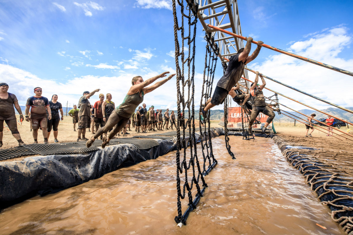 A lone athlete pushing through an extreme endurance course.
