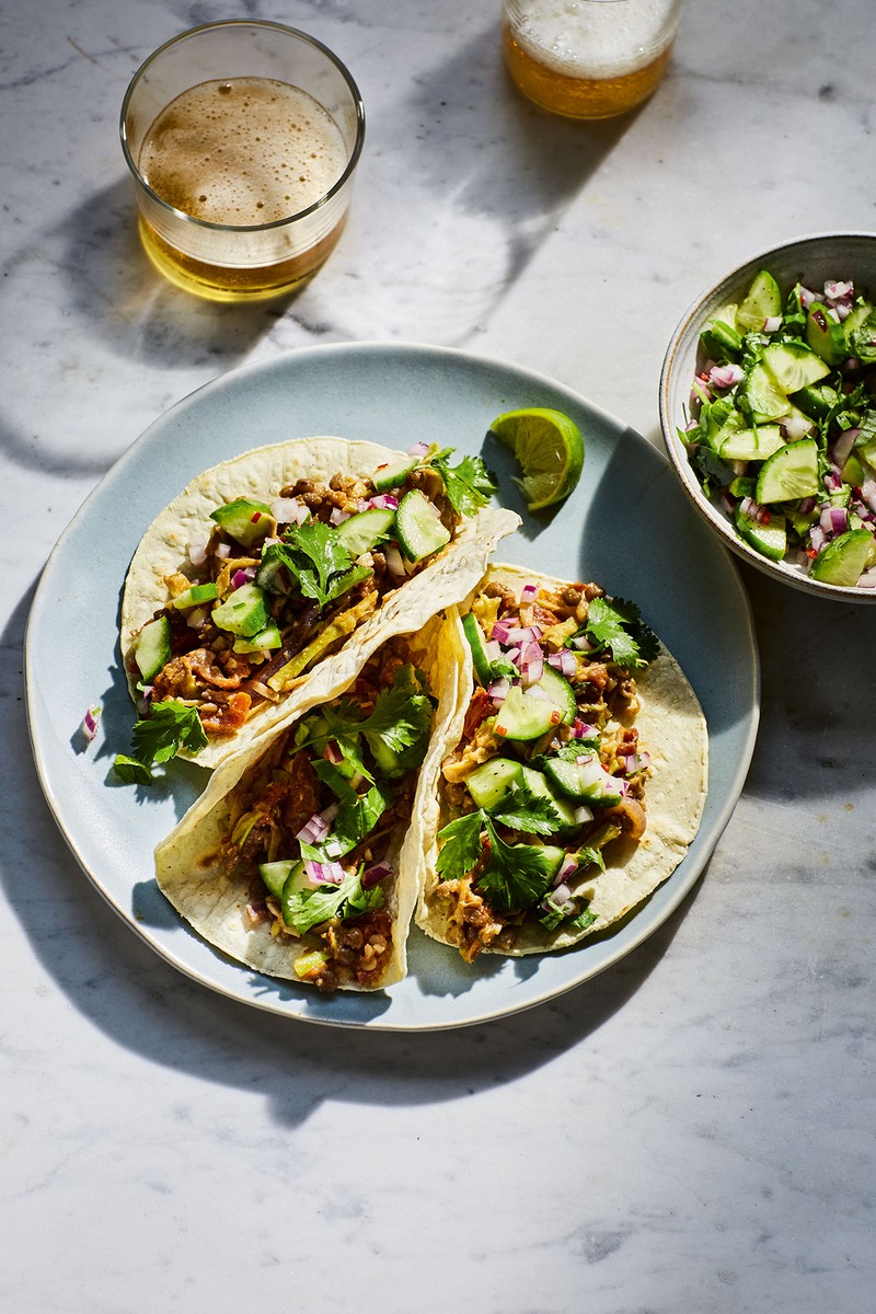 Tacos filled with smoky lentils and finely chopped broccoli stems.