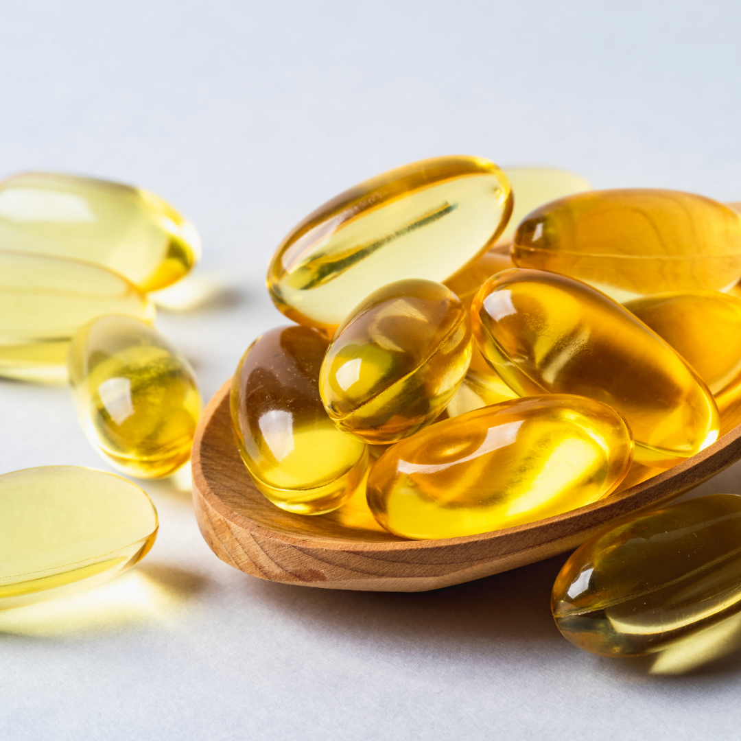Assorted food sources rich in Omega-3 fatty acids like salmon, nuts, and avocado.