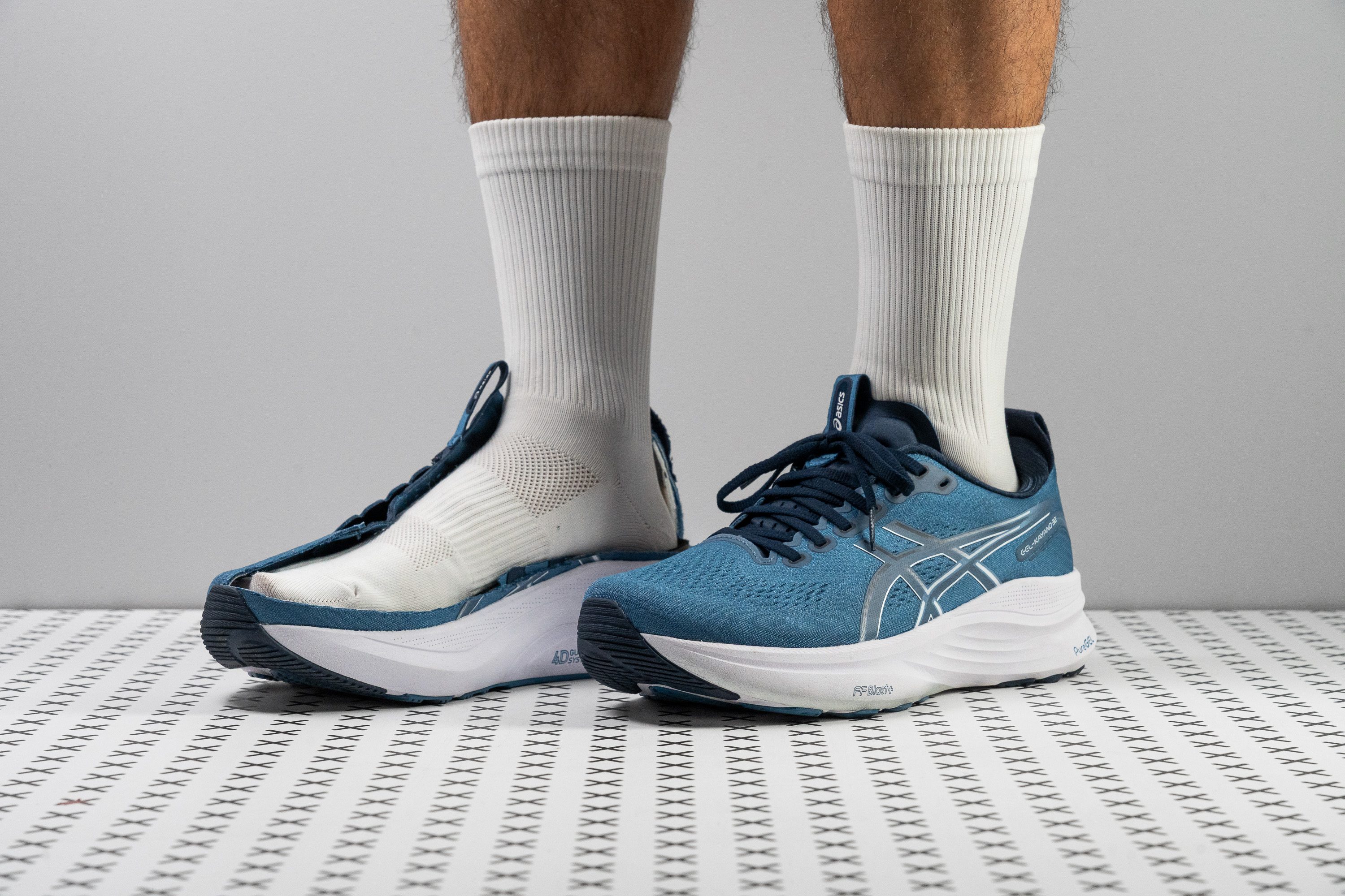 A side profile of the ASICS Gel Kayano 32 stability running shoe showcasing its high-traction outsole.