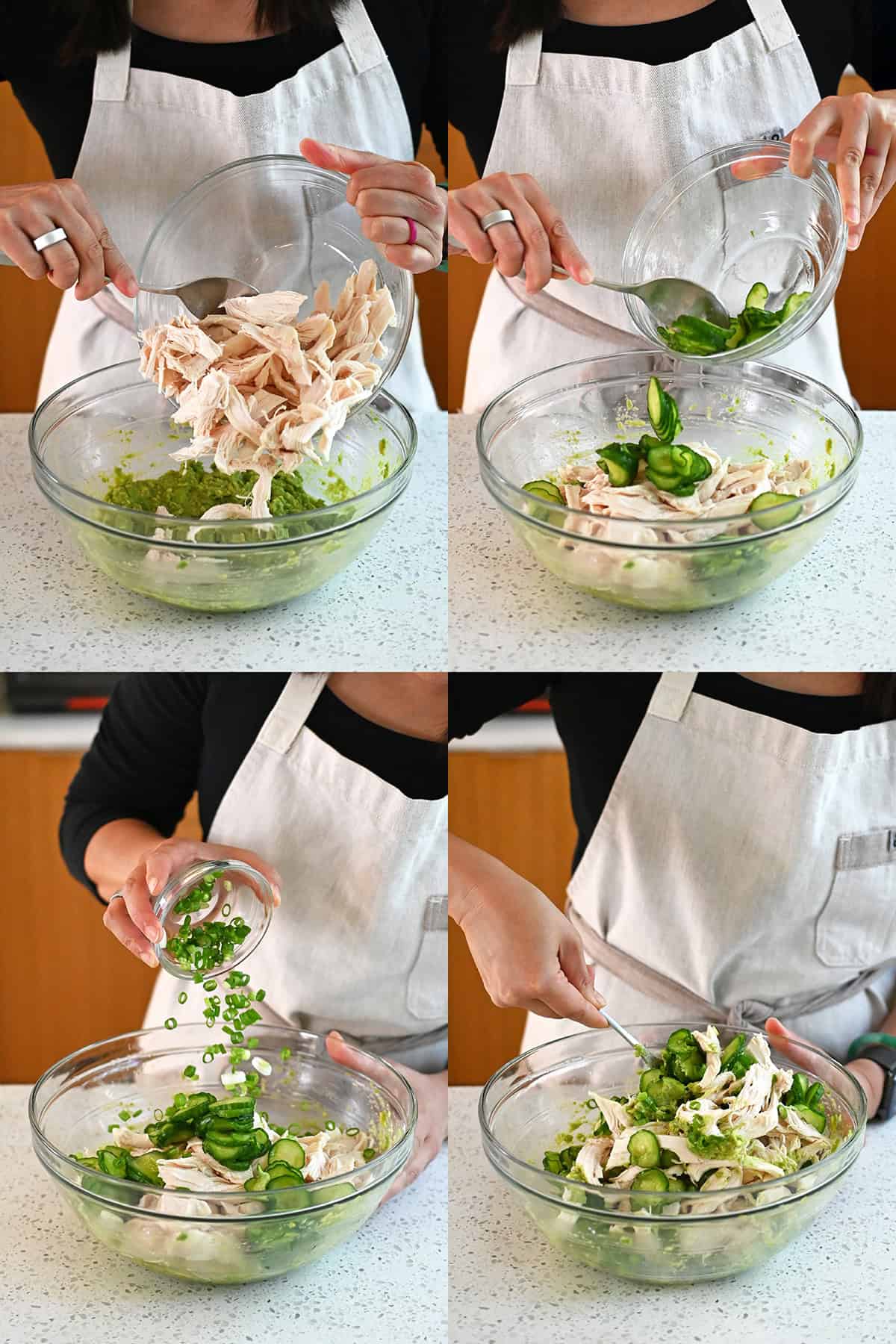 Shredded chicken, sliced cucumbers, and green onions being mixed into an avocado base.