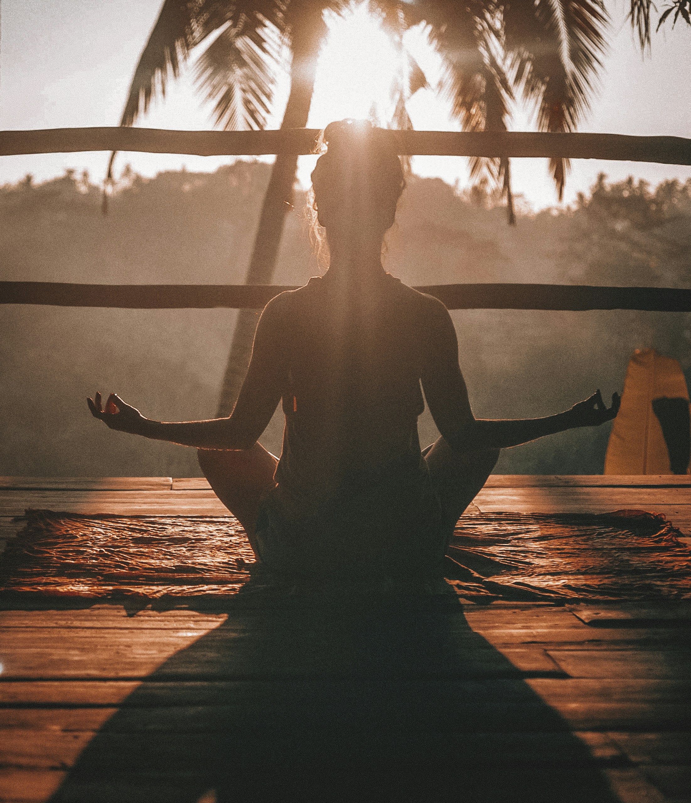 A person sitting in a peaceful environment practicing mindfulness meditation.