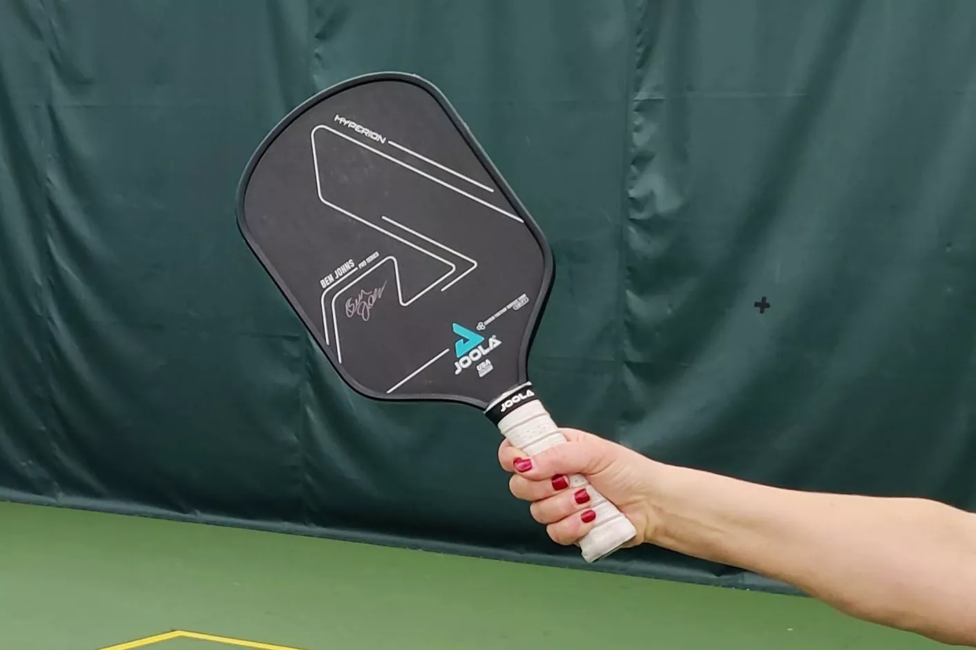 A close-up of the JOOLA Ben Johns Hyperion pickleball paddle.