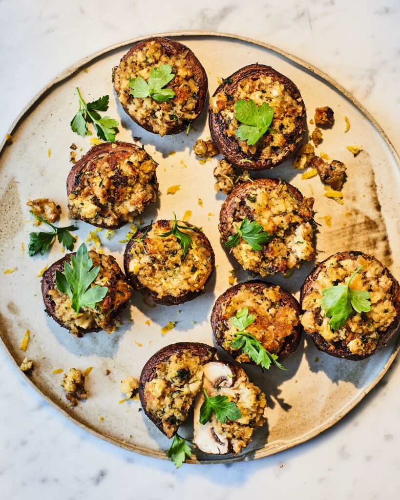 Stuffed mushrooms using leftover vegan Christmas stuffing, arranged as appetizers.